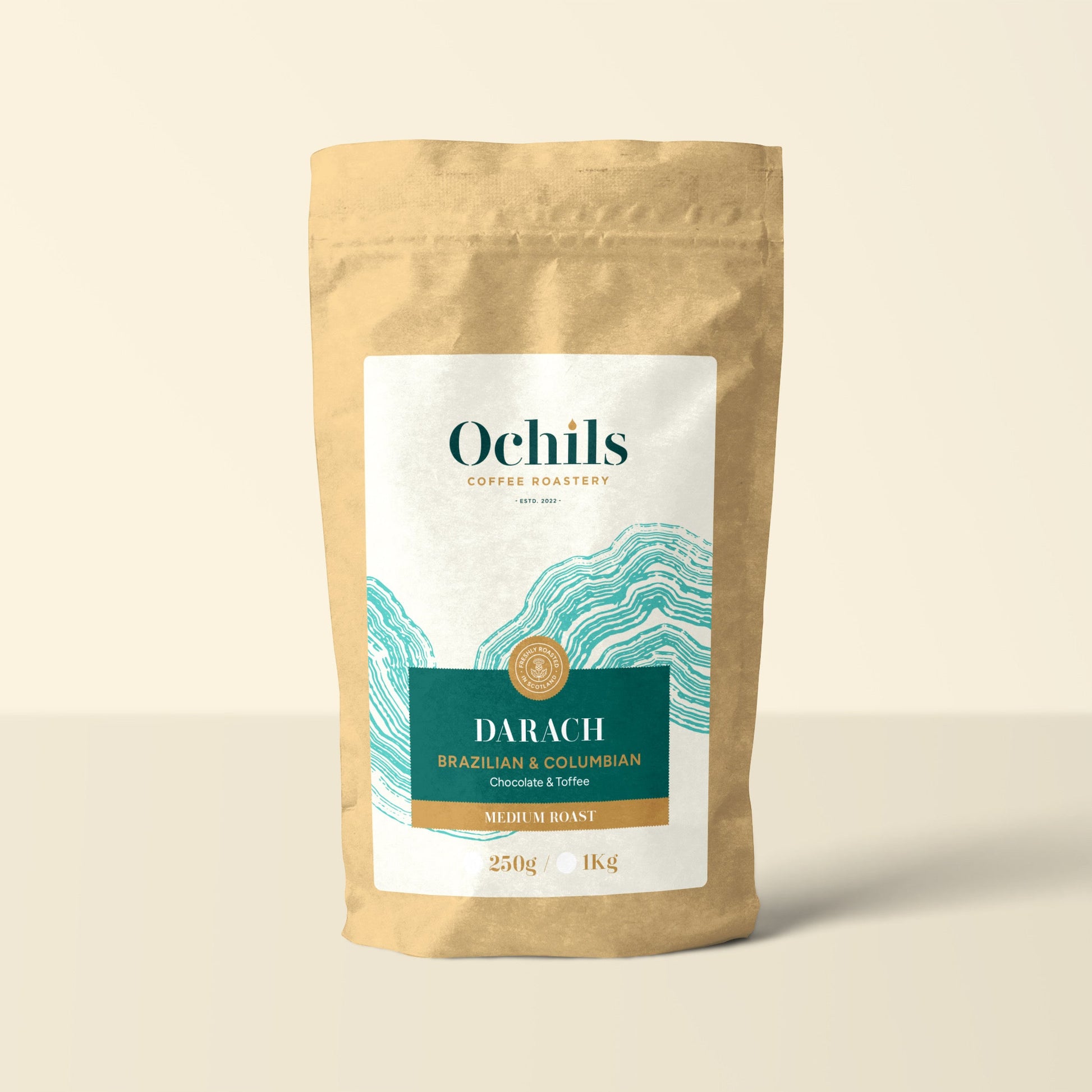 Ochils Coffee bag with teal label details on a beige background