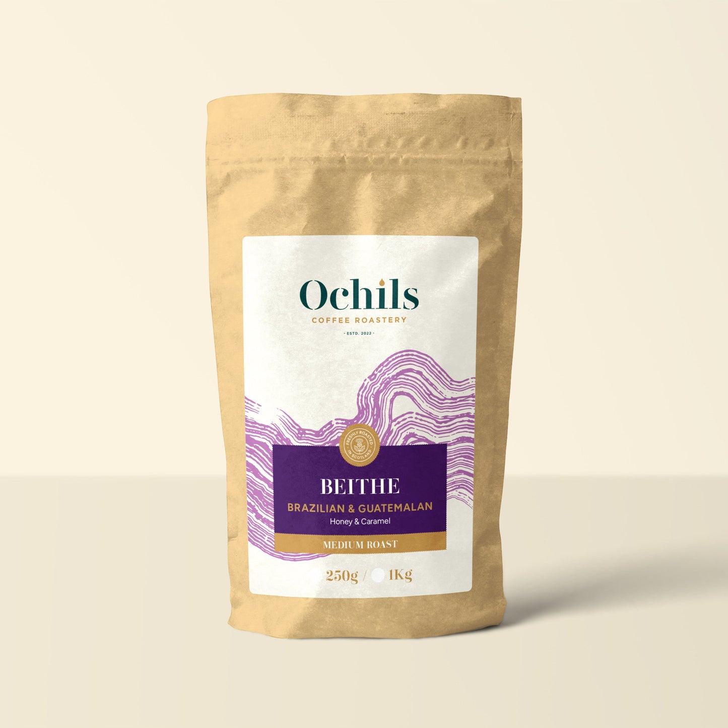 Ochils Coffee Bag with purple label details on a beige background