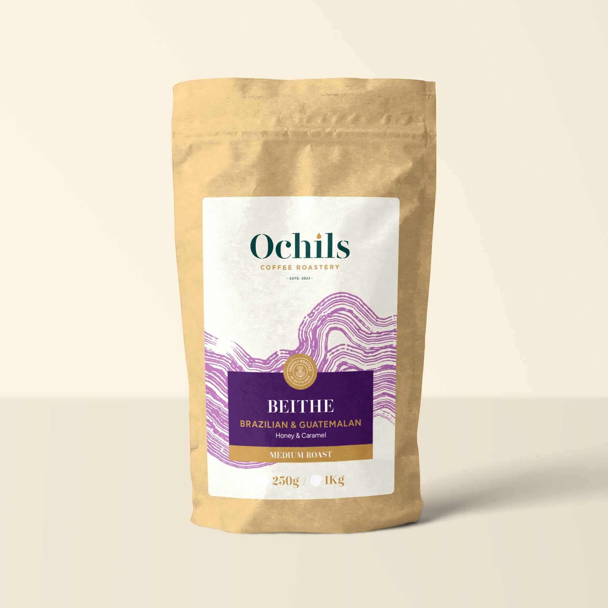 Ochils Coffee Bag with purple label details on a beige background